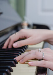 A woman is playing the piano