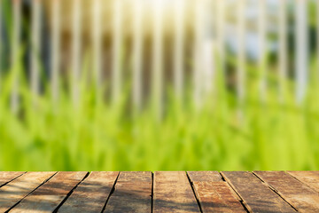 A wooden table on a blurry meadow background