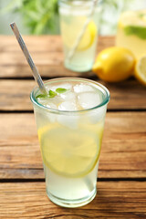 Fototapeta premium Natural lemonade with mint on wooden table. Summer refreshing drink