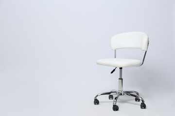Comfortable office chair on white background, space for text