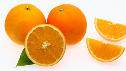 Oranges, fresh organic fruit cut in half, vitamin supplement