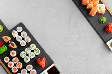 Maki sushi set served on black stone tray