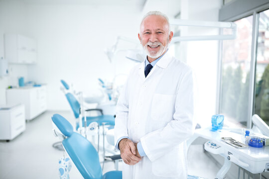 Happy and experienced dentist at the clinic