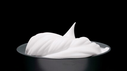 Fototapeta na wymiar Whipped White gentle cream on a black background