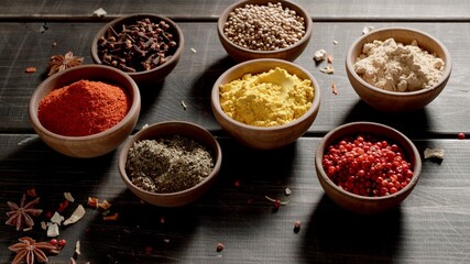 Many Spices and herbs on a table. Variety of colourful seasoning.