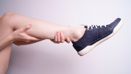 massage of leg muscles with hands, leg pain