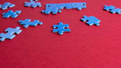 scattered puzzle pieces on colored background