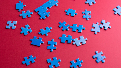 scattered puzzle pieces on colored background
