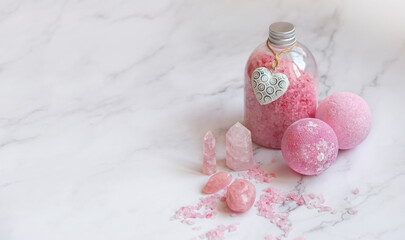 organic bath cosmetic, sea salt with rose quartz minerals on marble background. Spa therapy, Crystal Ritual, Esoteric, meditation, relax, life balance, body care concept. copy space