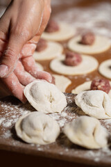 Dumplings making process, dough and minced meat