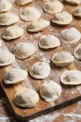Fototapeta na wymiar Dumplings making process, dough and minced meat