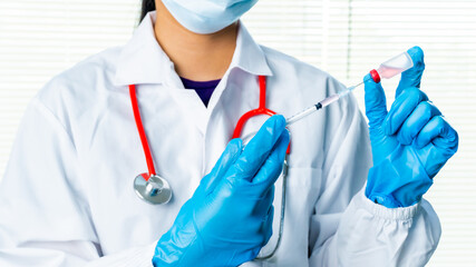 Doctors or scientists are carrying syringes with liquid vaccines for young and old to. prevent COVID-19 in the laboratory. Concept COVID-19 vaccine.