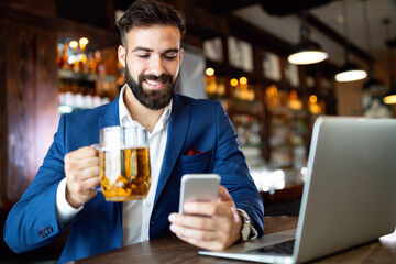 Young business man having a break in a restaurant. Work occupation business lifestyle concept