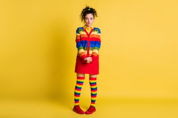 Full length photo of girlish lady playful mood wear striped sweater short skirt knee socks isolated...