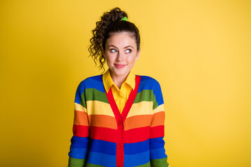 Photo of shy lady look ashamed side empty space wear rainbow sweater isolated yellow color background