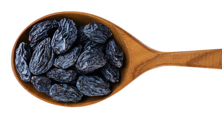 Wooden spoon with raisins isolated on white background.