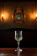 A vintage glass of white wine in a bar