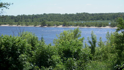 View of the river and hills from behind the trees