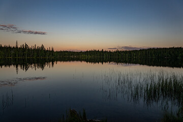 sunset reflection on lake in norway