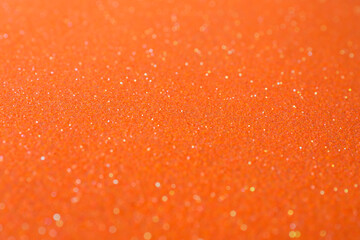 Orange textured surface as background, closeup view