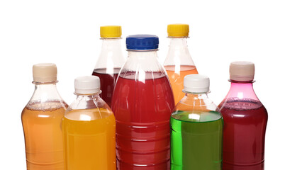 Bottles of soft drinks on white background, closeup