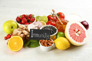 Card with phrase Immunity and fresh products on light table