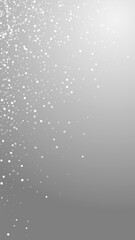 Random white dots Christmas background. Subtle flying snow flakes and stars on grey background. Adorable winter silver snowflake overlay template. Juicy vertical illustration.