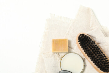 Composition with shoe care accessories on white background, top view