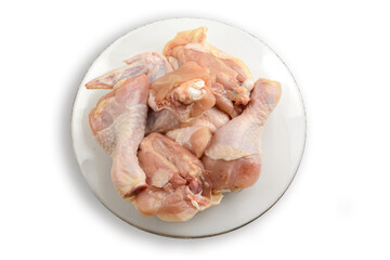 Raw chicken meat on a plate. Isolated on a white background.The view from the top. Healthy eating