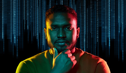 technology, cyberspace and programming concept - portrait of young african american man over binary...