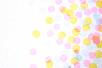 Colorful confetti on white background, top view