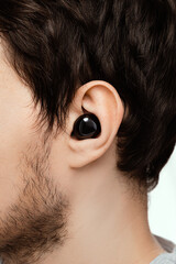 tiny little in ear earphones to listen to music, phone call and hide the surrounding by sounds and...