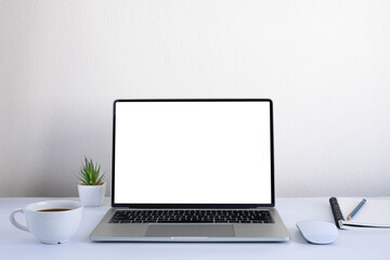 Fototapeta premium White office desk table with keyboard of laptop, coffee cup and notebook, mouse computer with equipment office supplies. Business and finance concept. Workplace, Flat lay with blank copy space.