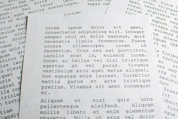 lorem ipsum dolor sit amet concept. selective focus photo of paper sheets with publishing and...