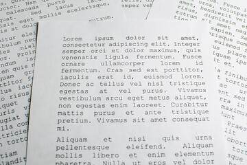 lorem ipsum dolor sit amet concept. selective focus photo of paper sheets with publishing and...