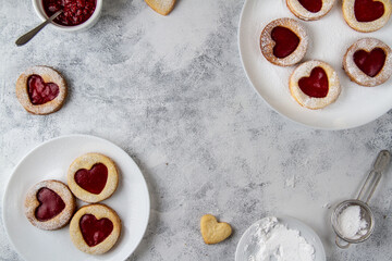 Frame on a gray background with cookies with red hearts.