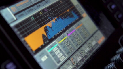 Equalizer on the monitor of a professional electronic mixer. Control panel for tuning sound channels. Monitor electronic mixer. Close-up