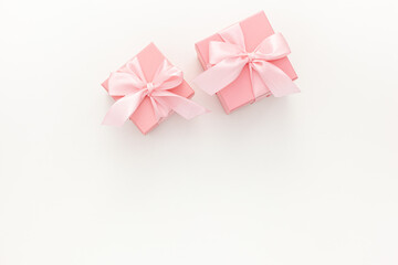 Valentines day composition: two pink gift boxes with ribbon