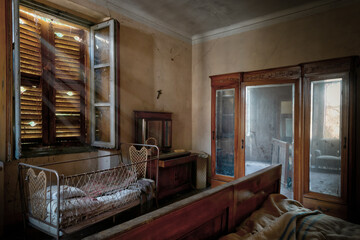 Italy, January 20, 2021. Bedroom in an abandoned country villa