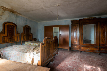 Italy, January 20, 2021. Bedroom in an abandoned country villa