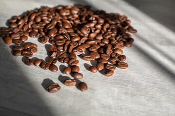 Coffee beans, isolated on a gray background.