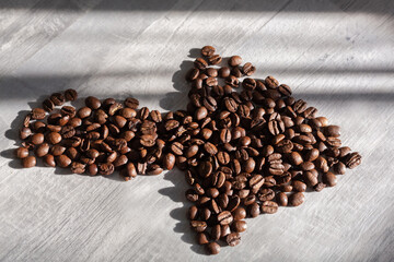 Close Up coffee beans in the shape of an arrow. 