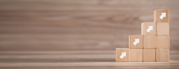 Wooden cube with arrows. Business. Growth. Success