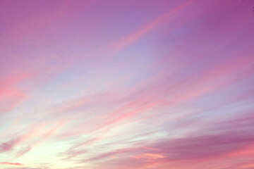 Beautiful pastel pink and purple skies and clouds in the evening as the sun sets. The sky is calm and beautiful at dusk, sweet sky.
