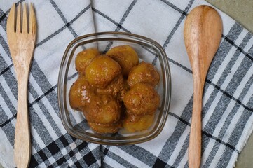Cilok is balls prepared with a base of tapioca flour. Whether boiled or fried, cilok balls are typically accompanied by a sweet peanut sauce or spicy sauces based on ketchup and kecap manis. 