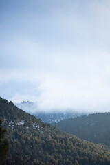 mountains with snow and fog