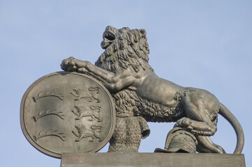 Old monument of a big lion with war shield as a defender located at the New Castle in Stuttgart,...