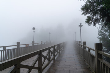 wooden bridge in fog