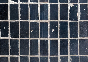 Black tiles on the wall