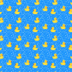 Bathroom background, yellow rubber ducks on a blue background with soap bubbles, children's background